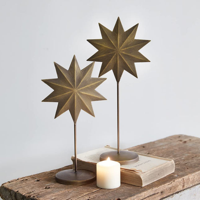 CTW Home Collection Antique Brass Star Pedestals, Set of Two, Metal, Home Accent, Tabletop Decor, Christmas